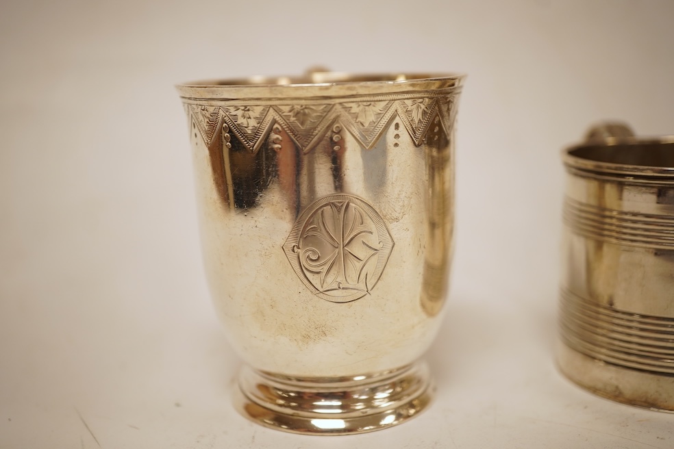A small late George III reeded silver christening mug, London, 1818, height 51mm, together with a later Victorian silver christening mug, Arthur Sibley, London, 1764.